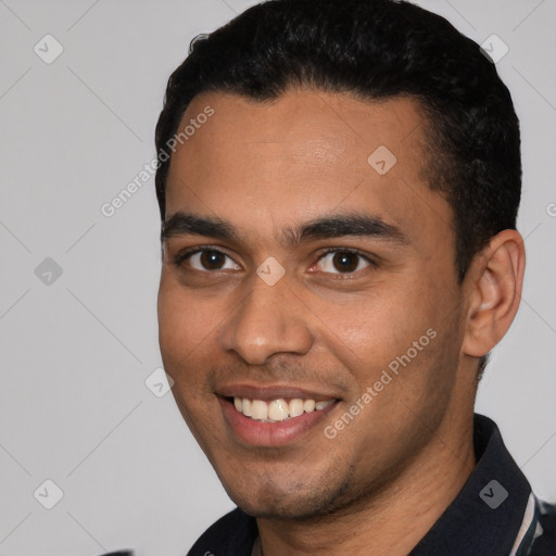 Joyful white young-adult male with short  black hair and brown eyes