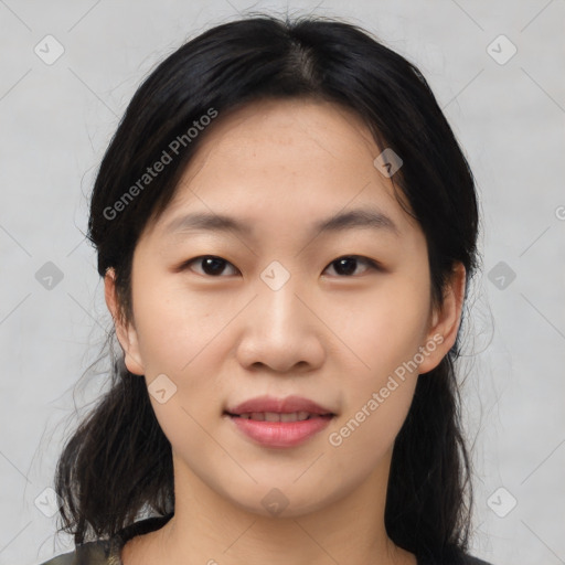 Joyful asian young-adult female with medium  black hair and brown eyes