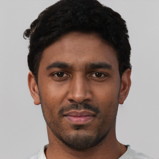 Neutral black young-adult male with short  black hair and brown eyes
