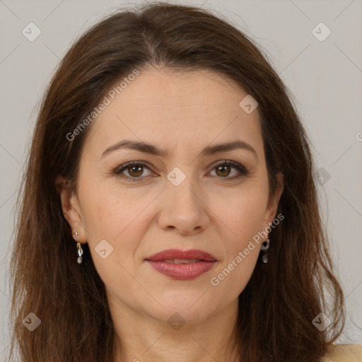 Joyful white adult female with long  brown hair and brown eyes