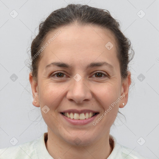 Joyful white adult female with short  brown hair and brown eyes