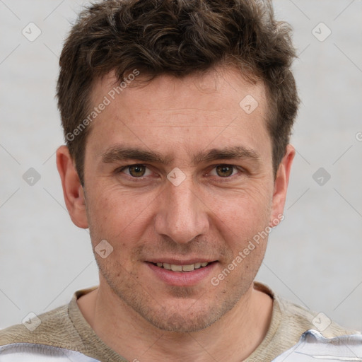 Joyful white adult male with short  brown hair and grey eyes