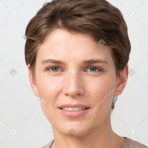 Joyful white young-adult female with short  brown hair and grey eyes