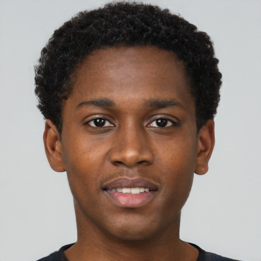 Joyful black young-adult male with short  brown hair and brown eyes