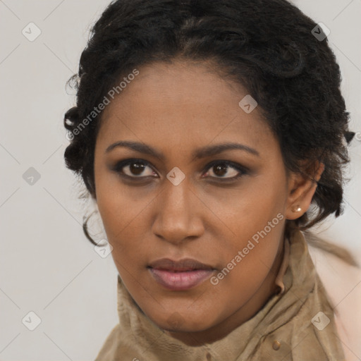 Joyful black young-adult female with long  brown hair and brown eyes