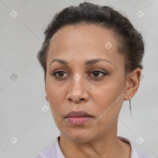 Joyful black adult female with short  brown hair and brown eyes