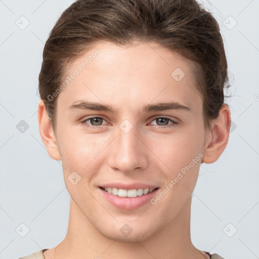 Joyful white young-adult female with short  brown hair and brown eyes