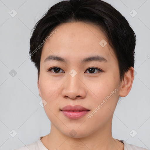 Joyful asian young-adult female with short  brown hair and brown eyes