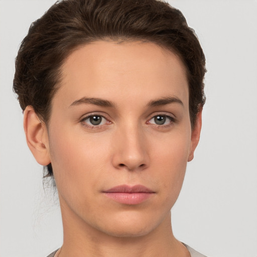 Neutral white young-adult female with short  brown hair and brown eyes