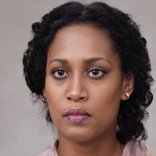 Neutral black young-adult female with medium  black hair and brown eyes