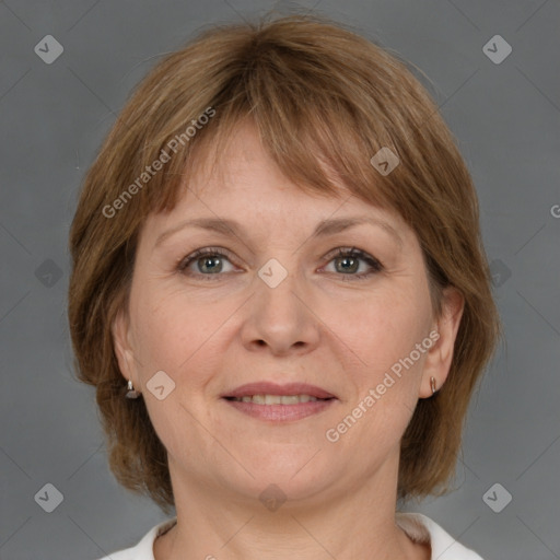 Joyful white adult female with medium  brown hair and grey eyes