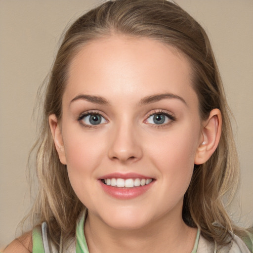 Joyful white young-adult female with medium  brown hair and blue eyes