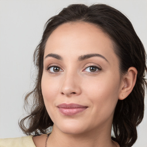 Joyful white young-adult female with medium  brown hair and brown eyes