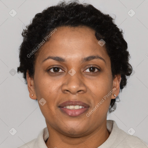 Joyful black adult female with short  brown hair and brown eyes