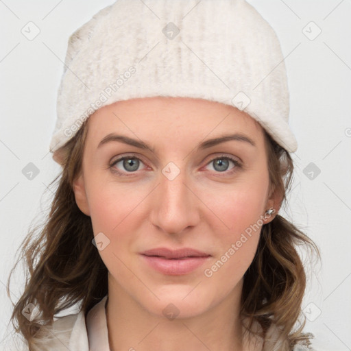 Joyful white young-adult female with medium  brown hair and blue eyes