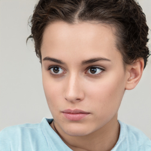 Neutral white young-adult female with short  brown hair and brown eyes