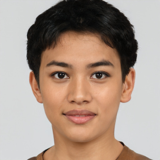 Joyful latino young-adult female with short  black hair and brown eyes