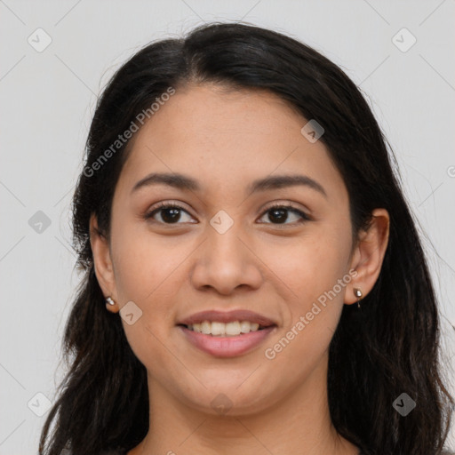 Joyful latino young-adult female with long  brown hair and brown eyes