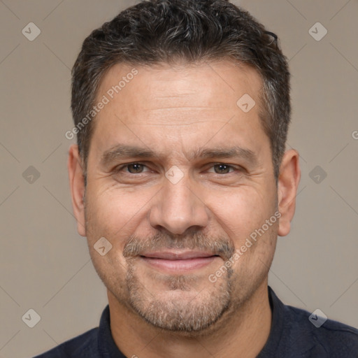 Joyful white adult male with short  brown hair and brown eyes