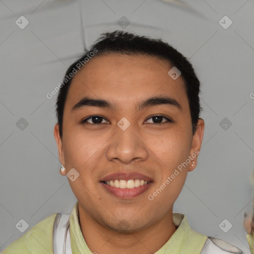 Joyful latino young-adult male with short  brown hair and brown eyes