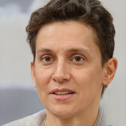 Joyful white adult female with short  brown hair and brown eyes