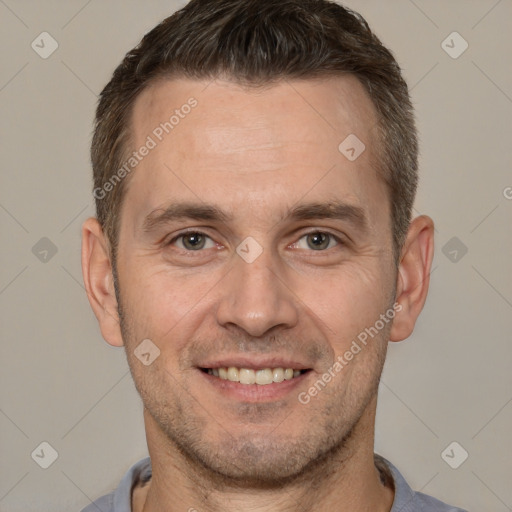 Joyful white adult male with short  brown hair and brown eyes