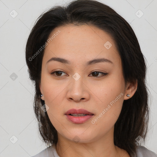 Joyful asian young-adult female with medium  brown hair and brown eyes