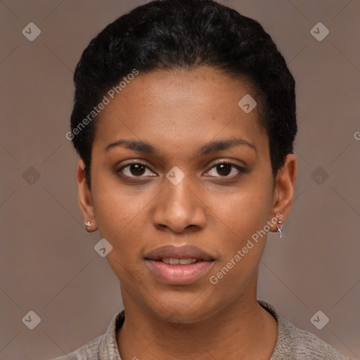 Joyful black young-adult female with short  black hair and brown eyes