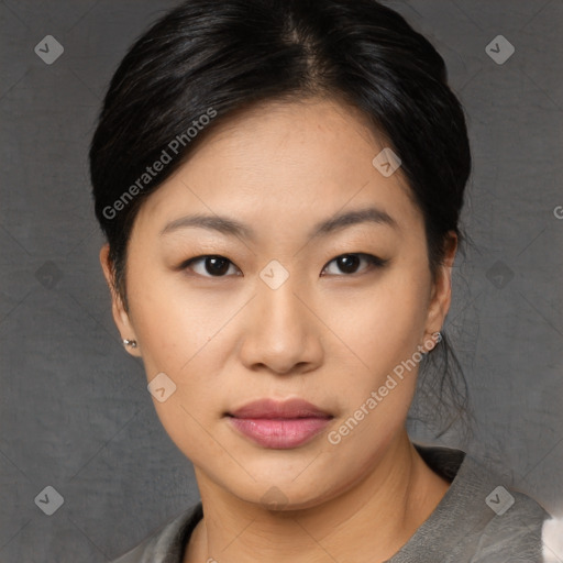 Joyful asian young-adult female with medium  black hair and brown eyes