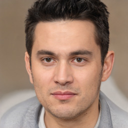 Joyful white adult male with short  brown hair and brown eyes