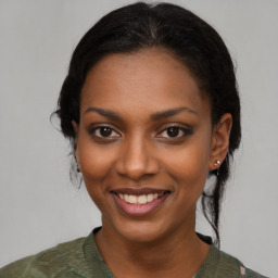 Joyful latino young-adult female with medium  black hair and brown eyes