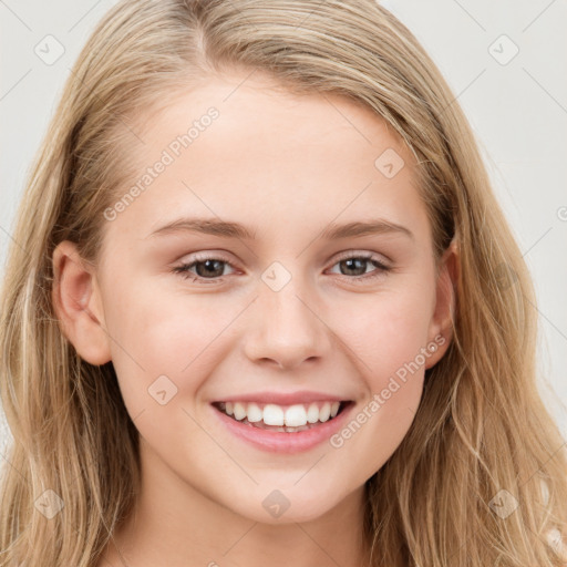 Joyful white young-adult female with long  brown hair and blue eyes