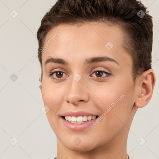 Joyful white young-adult female with short  brown hair and brown eyes