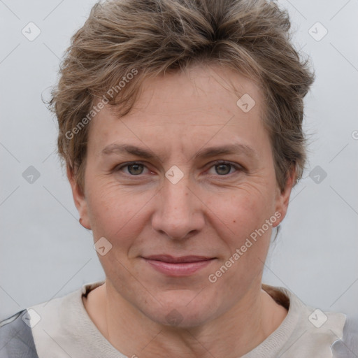 Joyful white adult female with short  brown hair and brown eyes