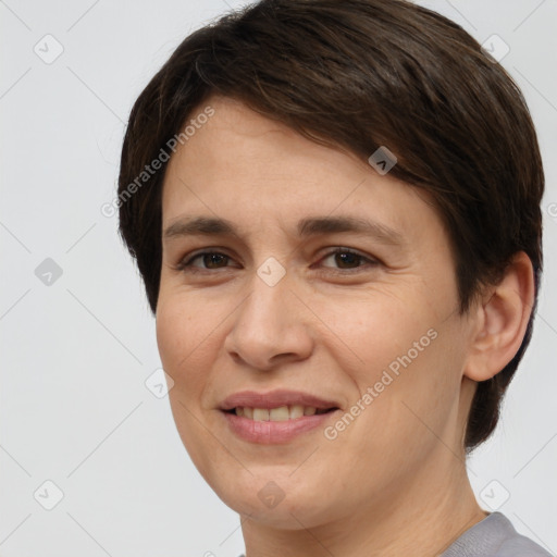 Joyful white adult female with short  brown hair and brown eyes