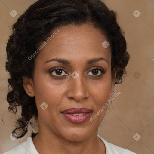 Joyful black adult female with medium  brown hair and brown eyes