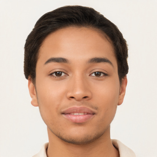 Joyful latino young-adult male with short  brown hair and brown eyes