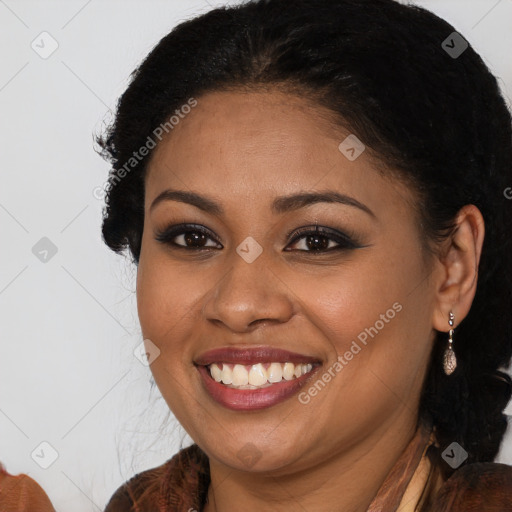 Joyful black young-adult female with long  brown hair and brown eyes