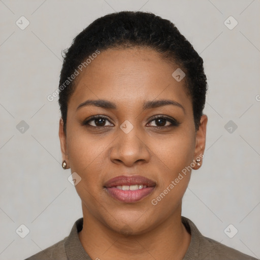Joyful black young-adult female with short  black hair and brown eyes