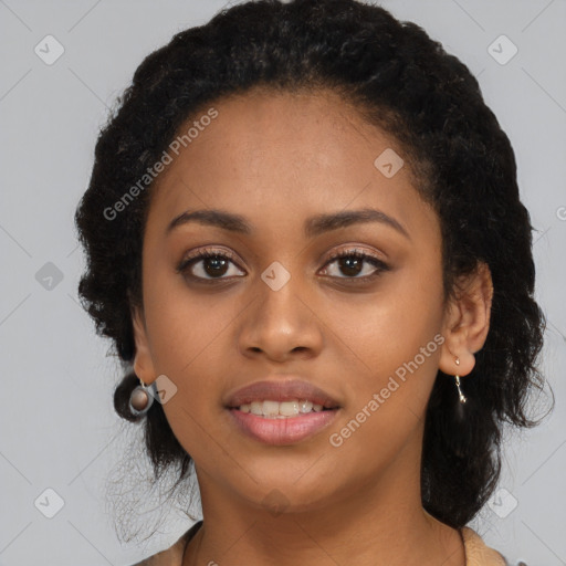 Joyful black young-adult female with long  black hair and brown eyes