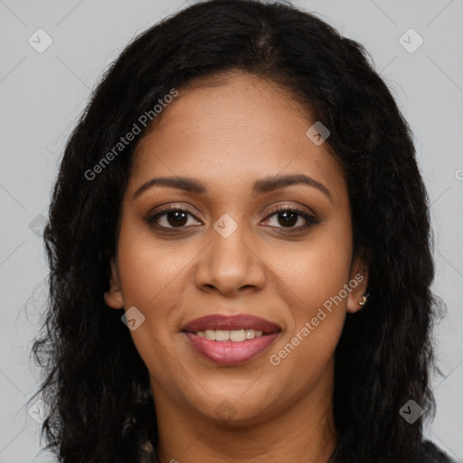 Joyful black young-adult female with long  brown hair and brown eyes