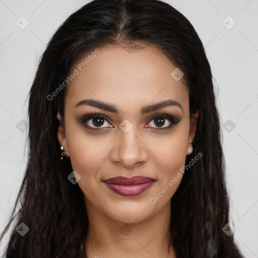 Joyful latino young-adult female with long  brown hair and brown eyes