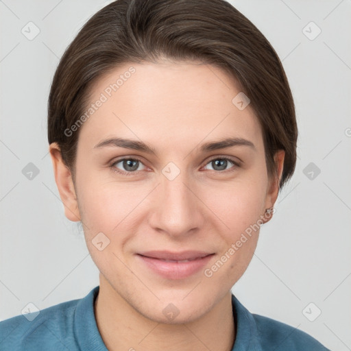 Joyful white young-adult female with short  brown hair and brown eyes