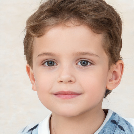 Joyful white child male with short  brown hair and brown eyes