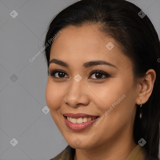 Joyful latino young-adult female with long  brown hair and brown eyes