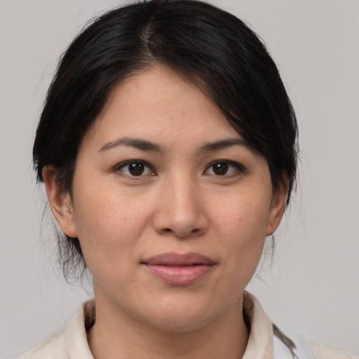 Joyful white young-adult female with medium  brown hair and brown eyes