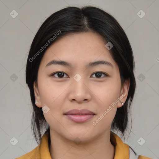 Joyful asian young-adult female with medium  black hair and brown eyes