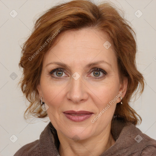 Joyful white adult female with medium  brown hair and blue eyes