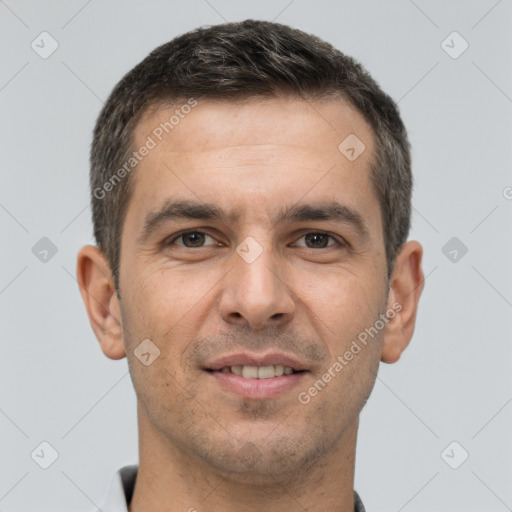 Joyful white young-adult male with short  brown hair and brown eyes