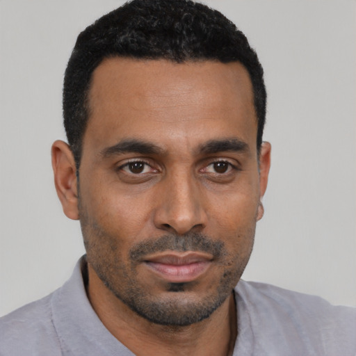Neutral black young-adult male with short  black hair and brown eyes